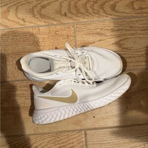 Nike White Sneakers  with Gold Swoosh